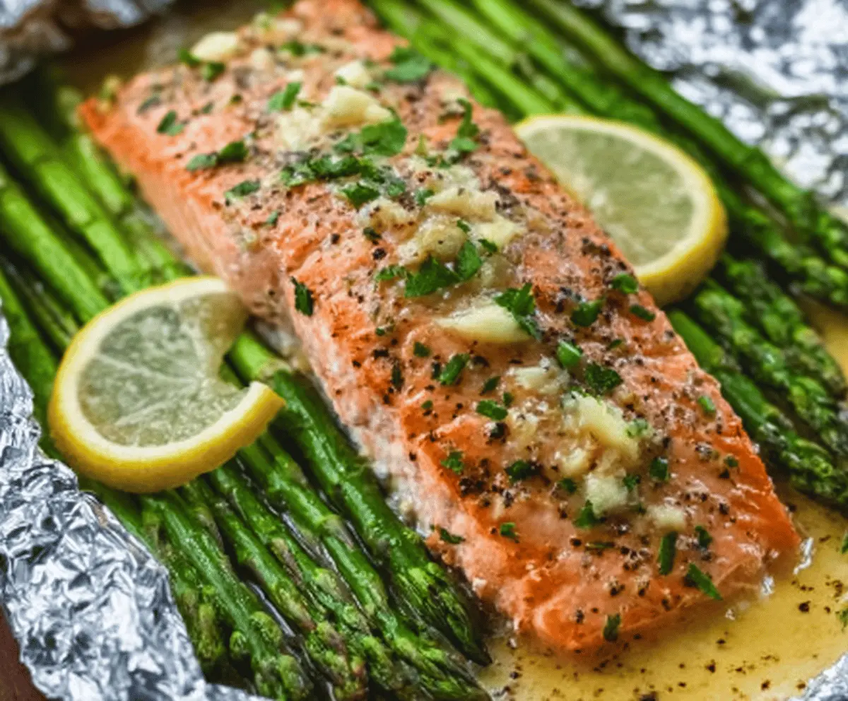 Baked Salmon In Foil With Asparagus And Lemon Garlic Butter Sauce