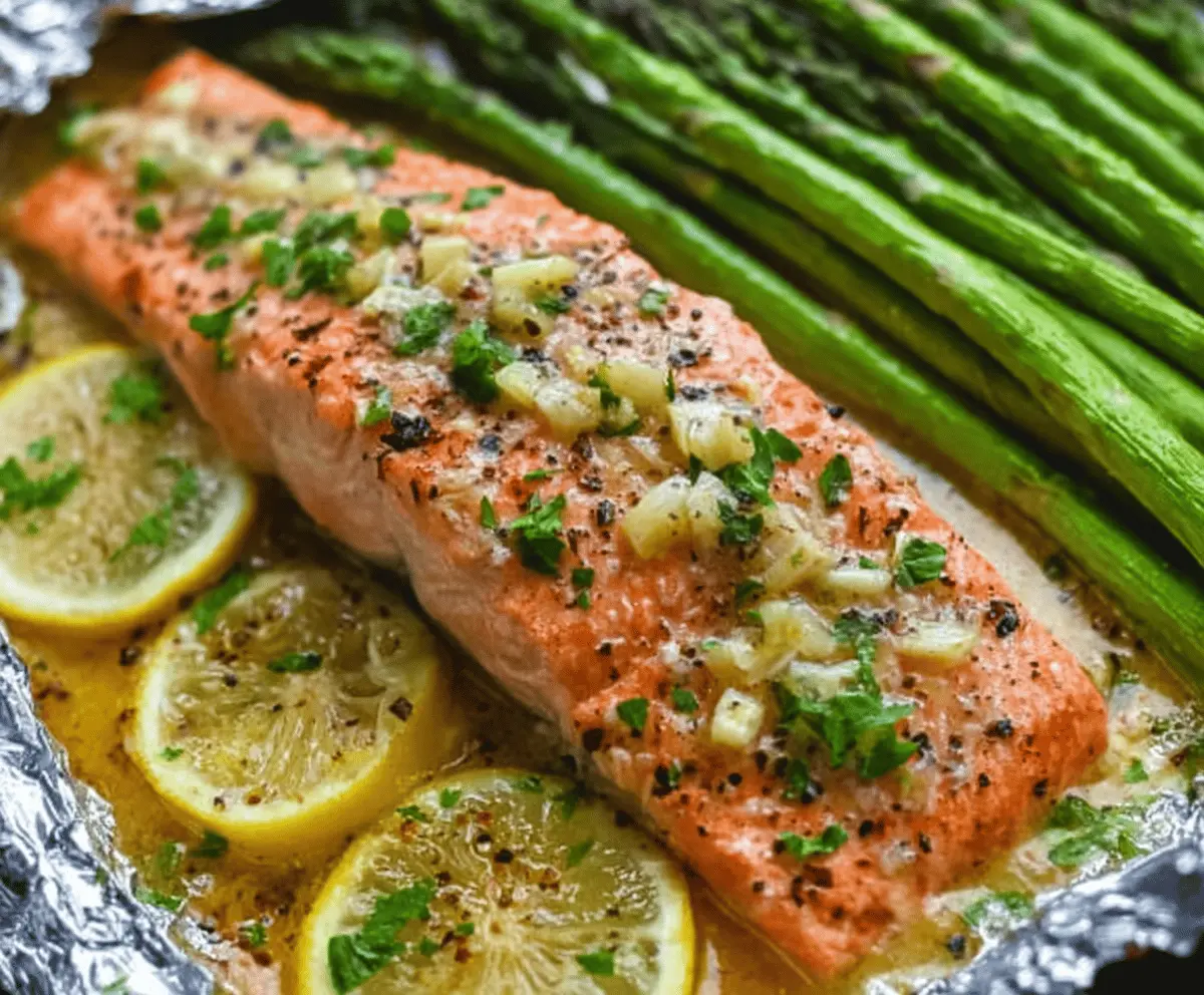 Baked Salmon In Foil With Asparagus And Lemon Garlic Butter Sauce